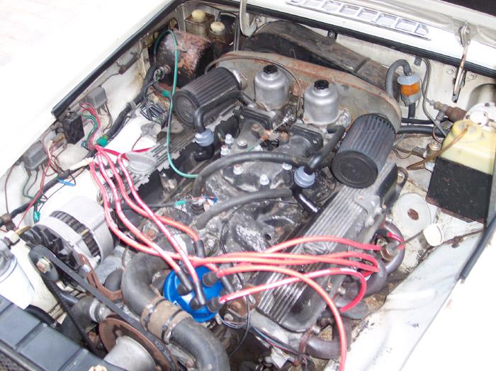 The car just purchased! Engine bay prior to top end re-build