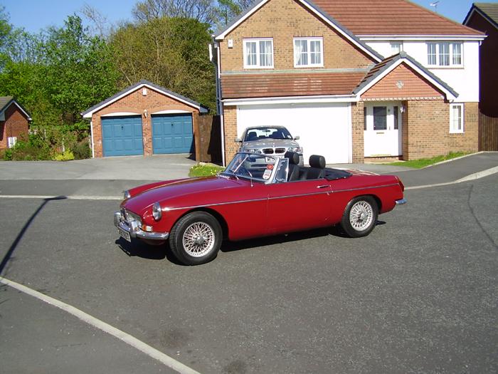 Freshly cleaned a polished MGB 79 in Damask Red with chrome conversion and wire wheels, leather seats. My pride and joy