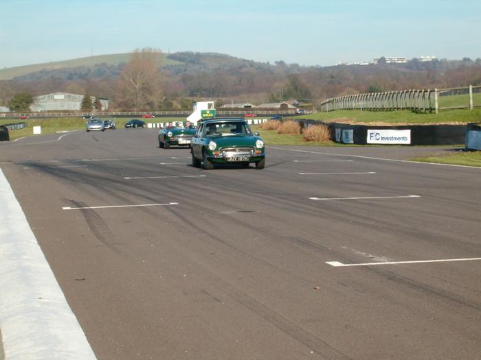 Shows MGs on the track at the Goodwood event in February 2008