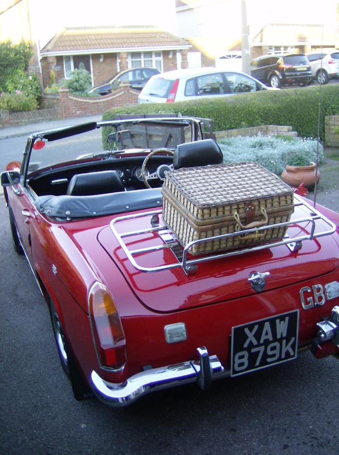 Still using my Midget rain shine or snow with roof down how mad is that?