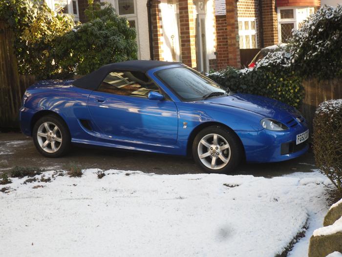 My MG TF doesnt get out much during the winter months,but heres a pic I found of her out in the snow.