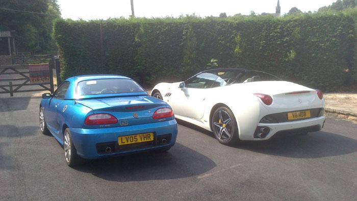 My neighbour borrowed his brothers Ferrari and took me for  a spin. I had to take a photo of them side by side.